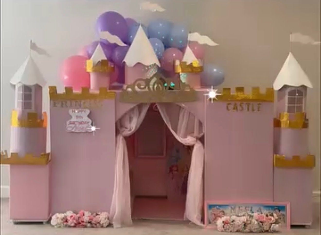 Pink and gold princess castle setup for a 5th birthday