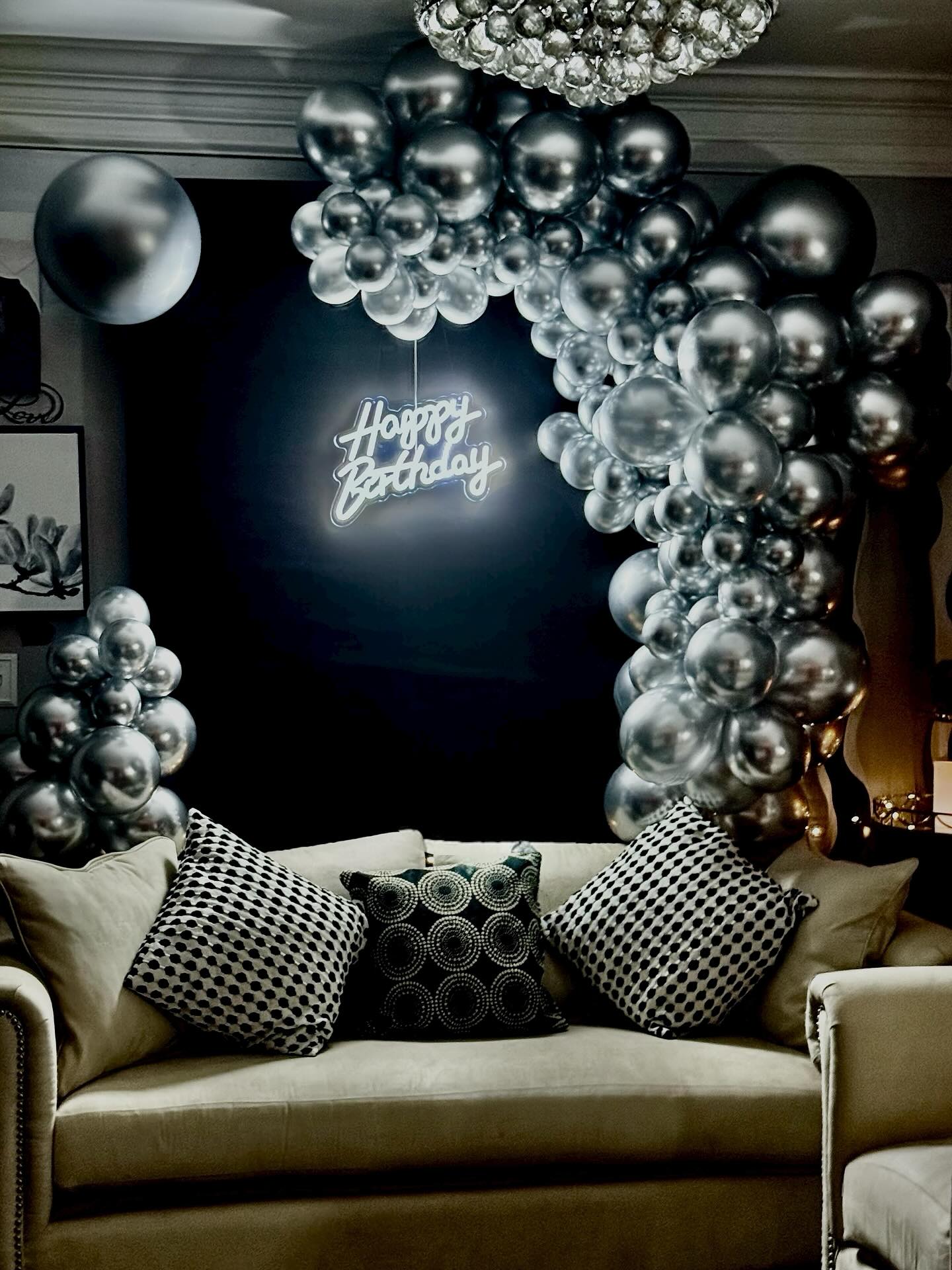 Black backdrop with silver balloons