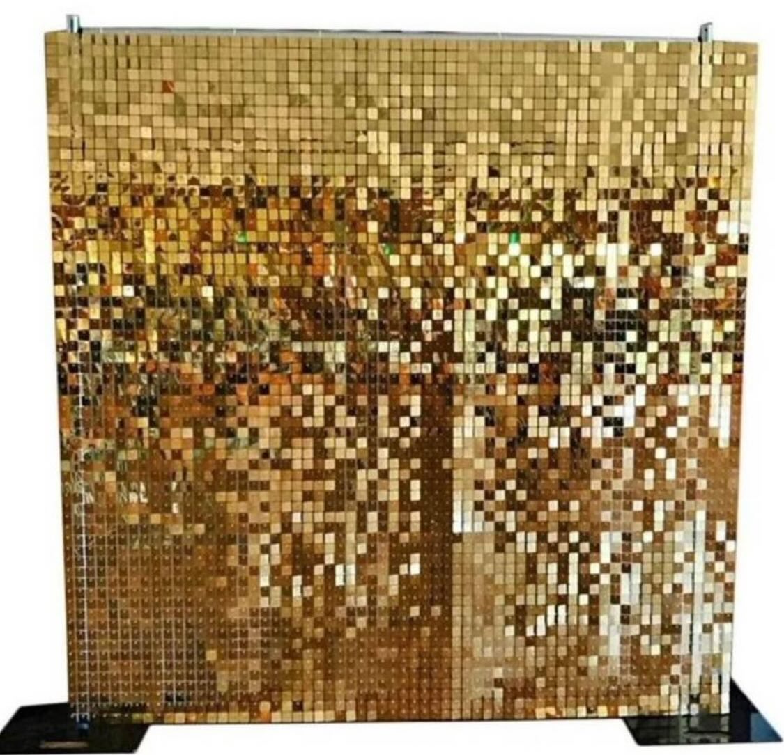 Gold sequin shimmer backdrop wall panel on a stand, freestanding against a plain background